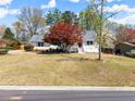 Charming single-Gathering home with a well-maintained lawn and mature landscaping at 385 Jayne Ellen Way, Alpharetta, GA 30009