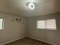 Bright bedroom featuring a ceiling fan and two windows, ready for your personal touch at 3025 Mckenzie Rd, Atlanta, GA 30344