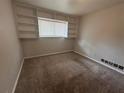 Bedroom featuring carpet, built-in shelves and neutral paint, ready for your personal touches at 3025 Mckenzie Rd, Atlanta, GA 30344