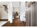 Grand foyer with soaring ceilings, hardwood floors, staircase, and elegant chandelier lighting at 6935 York Pl, Cumming, GA 30040