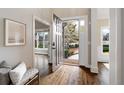 Bright foyer with hardwood floors and a view to the outside, showcasing natural light and an open floor plan at 6935 York Pl, Cumming, GA 30040
