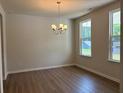 Bright dining room with natural light and wood flooring at 30 Riverrock Trl, Dallas, GA 30157