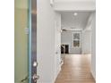 Light and airy entryway with wood flooring, leading into a living area at 30 Riverrock Trl, Dallas, GA 30157