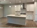 Spacious kitchen with modern appliances and a large center island, perfect for cooking at 30 Riverrock Trl, Dallas, GA 30157