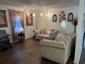 Cozy living room featuring hardwood floors, neutral walls, and comfortable couches at 4691 Bo Hendrick Dr, Austell, GA 30106