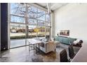 Bright living area with industrial-style windows and modern decor at 5200 Peachtree Rd # 1111, Atlanta, GA 30341