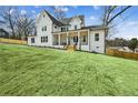 Beautiful two-story home with a well-manicured lawn and inviting front porch at 1967 Nash Se Ave, Atlanta, GA 30316