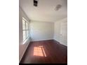Cozy bedroom with hardwood floors and a large window providing natural light at 2575 Picardy N Cir # B, Atlanta, GA 30349
