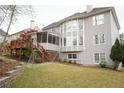 Exterior view of home with a deck and level backyard space at 1191 Crofton Landing, Suwanee, GA 30024