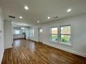 Open-concept living area flows into the kitchen, with beautiful wood floors at 438 Holly Nw St, Atlanta, GA 30318