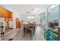 Bright dining area with hardwood floors, complemented by a large table and access to the staircase at 717 Chamberlain Sw Cir, Marietta, GA 30008