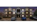 Night-time view of a well lit apartment building with convenient parking in front at 13304 Waldrop Cv, Decatur, GA 30034