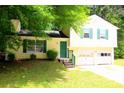 Traditional home with a cozy entrance and a convenient two-car garage at 2238 Scarbrough Dr, Stone Mountain, GA 30088