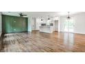 Spacious living room with hardwood floors and white paint, flowing into an open floorplan at 1741 Hasty Rd, Marietta, GA 30062