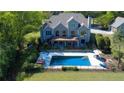 Inviting backyard with a private pool, large deck, and patio perfect for outdoor living and entertaining at 20 Rivercreek Xing, Kingston, GA 30145