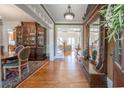 Elegant foyer featuring gleaming hardwood floors, classic decor, and an inviting atmosphere throughout the home at 20 Rivercreek Xing, Kingston, GA 30145