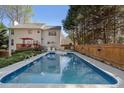 Backyard swimming pool with a spacious deck and privacy fence, perfect for outdoor relaxation and entertainment at 3823 Briarstone Cv, Snellville, GA 30039