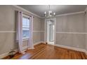 Dining room featuring hardwood floors, neutral paint, and views of the kitchen at 605 Harold Ne Ave, Atlanta, GA 30307