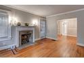 Living room featuring hardwood floors, fireplace with mantle, and neutral gray paint at 605 Harold Ne Ave, Atlanta, GA 30307