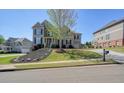 Attractive home with a manicured front yard, mulch, and landscaping creates great curb appeal at 302 Grant Ct, Canton, GA 30114