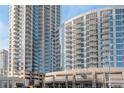 An exterior shot of a condominium building featuring modern design and expansive windows at 400 W West Peachtree Nw St, Atlanta, GA 30308