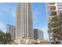 Exterior view of a modern high-rise condominium featuring balconies and stylish design at 400 W West Peachtree Nw St, Atlanta, GA 30308