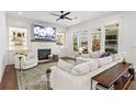 Comfortable living room featuring a fireplace, built-in shelving, and lots of natural light at 1291 Briarwood Ne Rd, Brookhaven, GA 30319