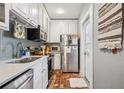 Functional kitchen with stainless steel appliances and ample counter space, ready for cooking at 737 Barnett Ne St # C4, Atlanta, GA 30306