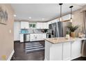 Modern kitchen featuring stainless steel appliances, granite countertops, and white cabinets with a breakfast bar at 1094 Regent Sw St, Atlanta, GA 30310