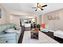 Bright living room with hardwood floors, a decorative rug, comfortable sofas and view to the kitchen at 1094 Regent Sw St, Atlanta, GA 30310