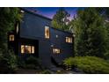 Beautiful modern home with sleek black exterior at dusk at 4 W Wesley Nw Rdg, Atlanta, GA 30327