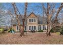 Expansive back of home with a patio area, perfect for outdoor entertaining and relaxation at 905 Attaway Rd, Bowdon, GA 30108