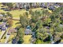 Beautiful aerial view of neighborhood homes and the golf course at 2480 Roxburgh Dr, Roswell, GA 30076