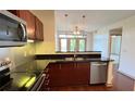 Kitchen with granite countertops, stainless steel appliances and barstool seating at 390 17Th Nw St # 4037, Atlanta, GA 30363