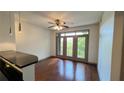 Bright living room with hardwood floors and patio access at 390 17Th Nw St # 4037, Atlanta, GA 30363