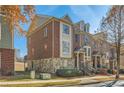 Attractive townhome exterior with brick, stone, and landscaped lawn in a desirable neighborhood at 3901 High Dove Sw Way # 17, Smyrna, GA 30082