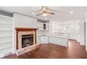 Inviting living room with a fireplace, built-in shelves, and hardwood floors at 906 John Ct, Lawrenceville, GA 30046