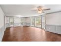 Bright living room with hardwood floors, large windows and view to the yard at 906 John Ct, Lawrenceville, GA 30046
