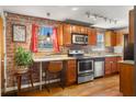 Updated kitchen features stainless steel appliances, exposed brick, and a breakfast bar at 562 Formwalt Sw St # 5, Atlanta, GA 30312