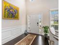 Inviting foyer with hardwood floors, wainscoting, and a bright, airy feel at 606 Discovery Ct, Acworth, GA 30102