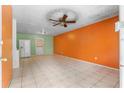Spacious living area features tile flooring and bright walls at 126 Washington St, Mcdonough, GA 30253