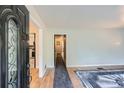 A light and bright foyer featuring hardwood floors, a decorative front door, and multiple entryways at 2875 Oldknow Nw Dr, Atlanta, GA 30318