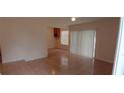 An open-plan living room with sliding glass doors and tiled floors at 3223 Strawberry Ln, Decatur, GA 30034