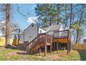 Well-maintained backyard with a wooden deck and stairs, ideal for outdoor activities and relaxation at 1591 Athens Sw Ave, Atlanta, GA 30310