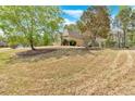 Expansive front lawn features mature trees and landscaping at 4162 Crowder Nw Dr, Kennesaw, GA 30152