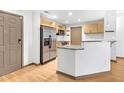 Efficient kitchen with stainless appliances, granite counters, and stylish cabinets at 390 17Th Nw St # 4048, Atlanta, GA 30363