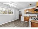 Efficient kitchen features updated floors and window with natural light at 5904 Heatherwood Ln, Riverdale, GA 30296