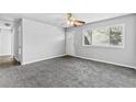Bright living room features updated floors, a ceiling fan, and freshly painted walls at 5904 Heatherwood Ln, Riverdale, GA 30296