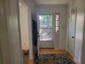 Bright entryway featuring hardwood floors and a storm door that lets in natural light at 3905 Hunters Chase, Conyers, GA 30094