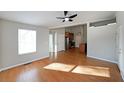Open-concept living space with hardwood floors, recessed lighting, and seamless transition to the kitchen area at 837 Forrest Se Cir, Atlanta, GA 30354